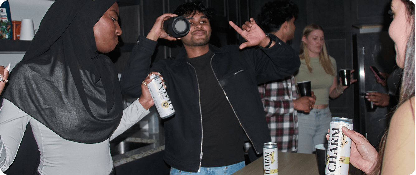 People enjoying Charm Social Tonic at a party